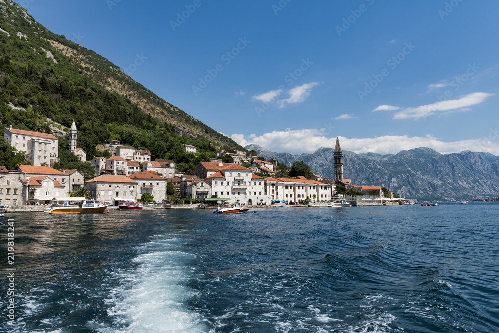 The bell tower of St Nicholas Church and the village of Perast in Montenegro. Perast is a beautiful village that sits on the bay of Kotor on the adriatic sea.