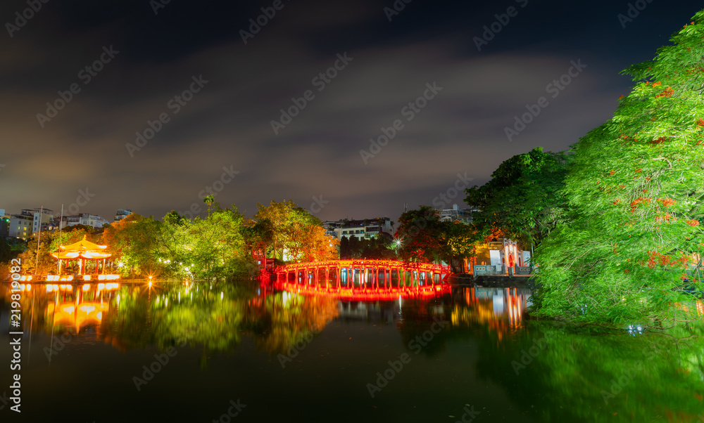 OLD QUARTER, HANOI/VIETNAM - JULY 28: Night view of The Huc bridge and Ngoc Son temple on 07 28 2018 in Lake of the Returned Sword, Lake of the Restored Sword, Hoan Kiem Lake. Landmark in vietnamese.