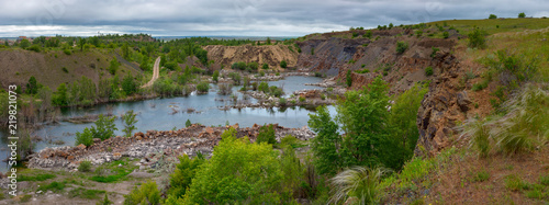 The beautiful scenery of abandoned sandstone quarry with the lake on the bottom