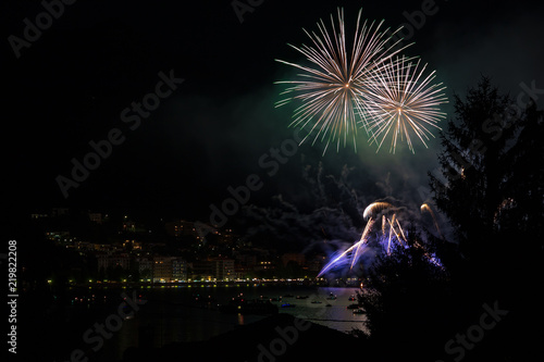 Photos panoramic view of omegna during a fireworks display