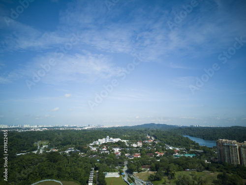 Photography Horizontal shot of a suburb residential district with a beautiful clear blue sky