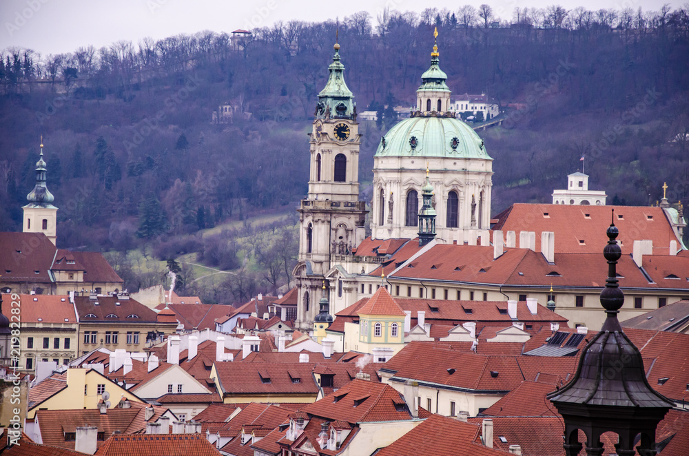 The domes of Prague and yours mountains. Czech Republic