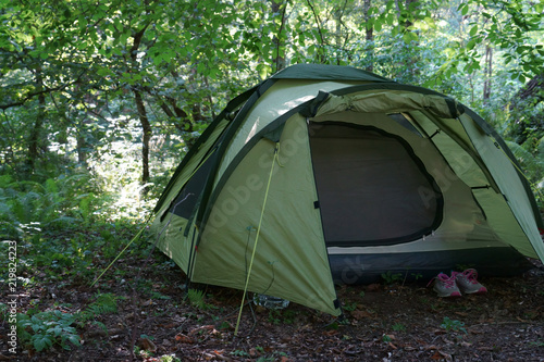 Image of a tourist tent in the forest.