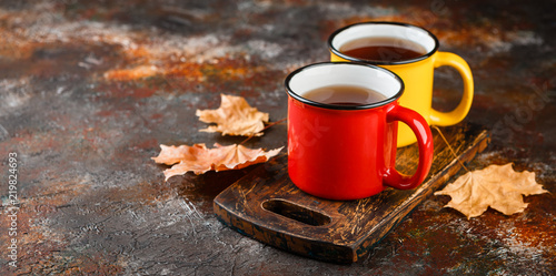 Enameled cup of hot tea photo