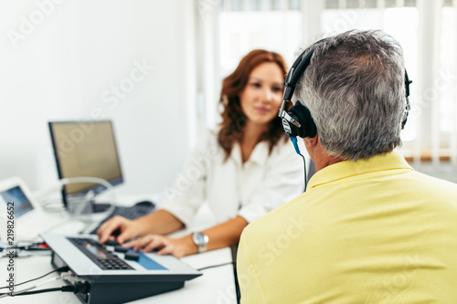 Senior man at medical examination or checkup in otolaryngologist's office