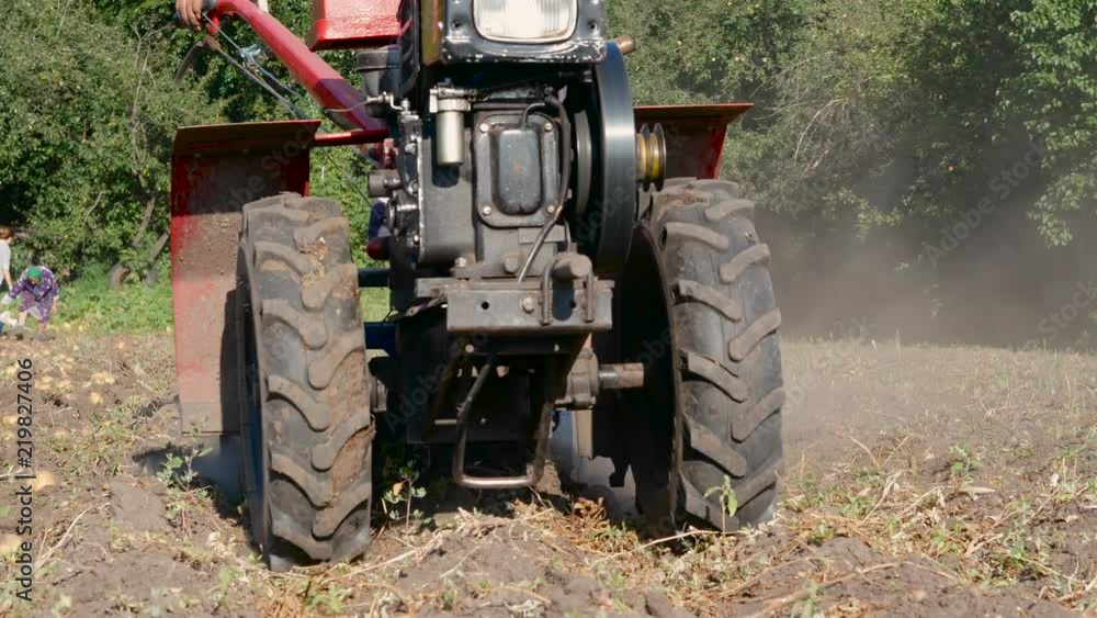 Close up view of harvest machine used by farmer on his potato field Close up view of harvest machine used by farmer on his potato field