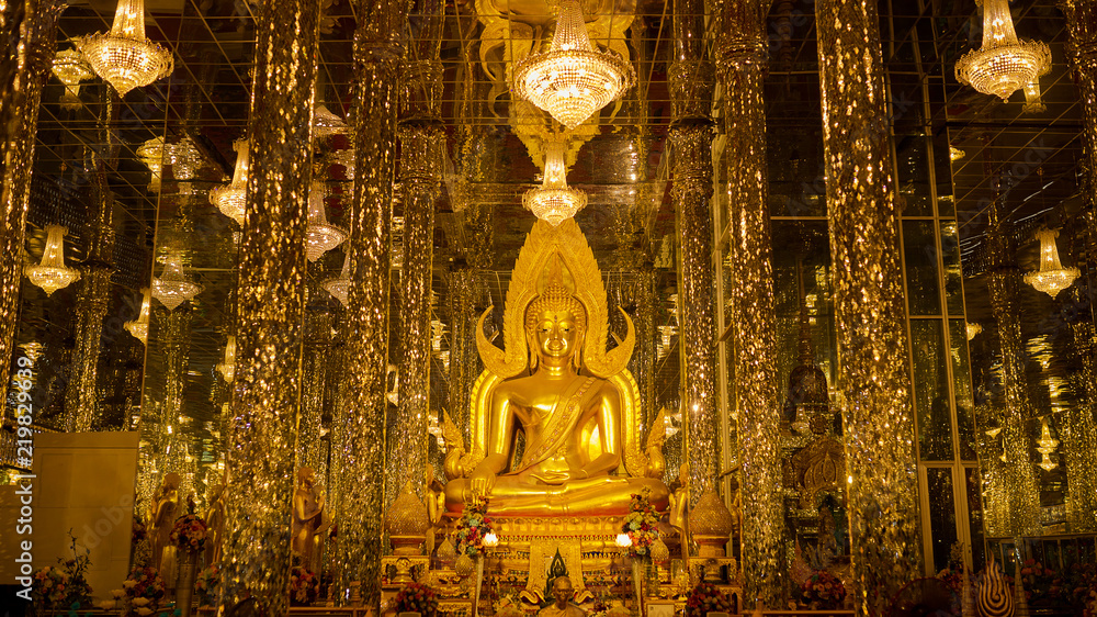Phra Buddha Chinnarat golden buddha statue in Wat Tha Sung Uthai Thani, Thailand. Inside the temple is decorated with Moses. Phra Buddha Chinnarat golden buddha statue in Wat Tha Sung Uthai Thani, Thailand. Inside the temple is decorated with Moses.