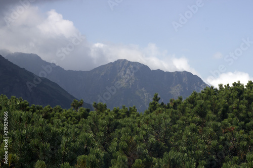 Apocalyptic view on mountains  Tatras  Poland. Clouds touch the mountains