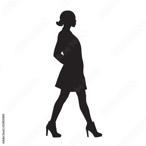 Slim woman walking, side view, isolated vector silhouette. Short clothes, high heels shoes