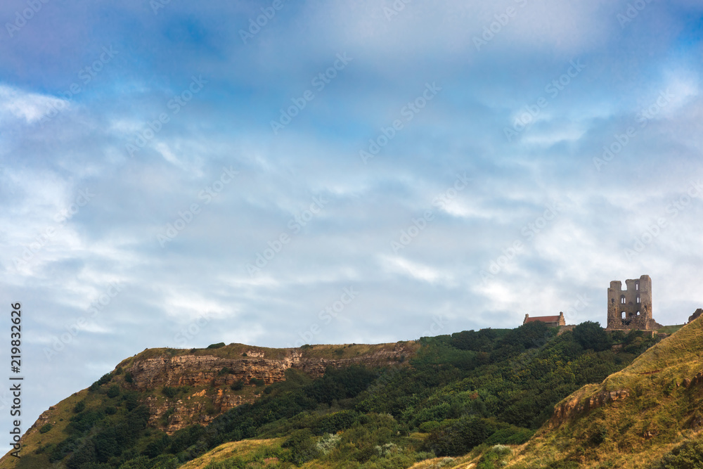 Dramatic cliff side landscape with Scarborough Castle in North Yorkshire.