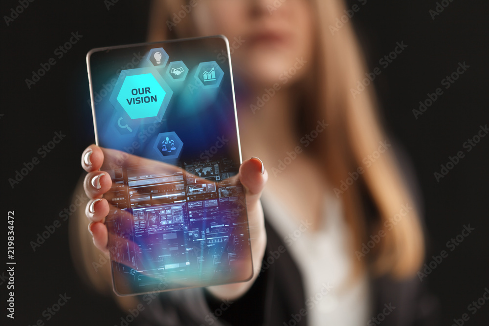 The concept of business, technology, the Internet and the network. A young entrepreneur working on a virtual screen of the future and sees the inscription: Our vision