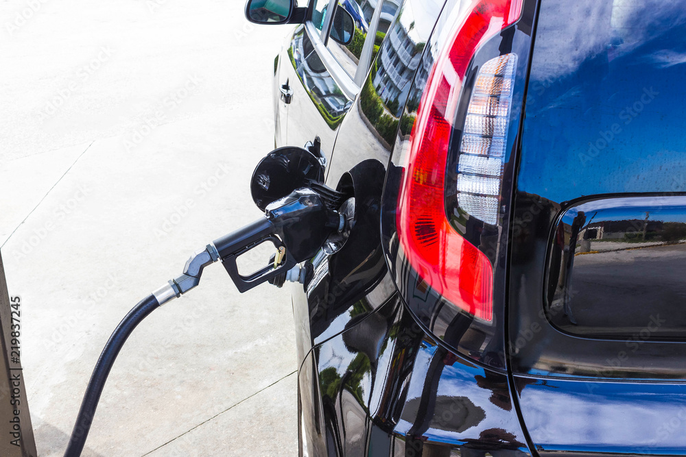 Car refueling on petrol station. Fuel pump with gasoline. fuel industry or transportation concept