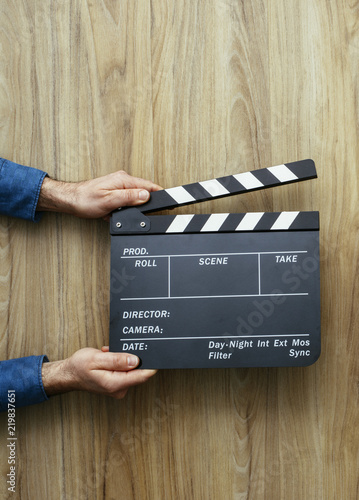 Director holding a clapper board photo