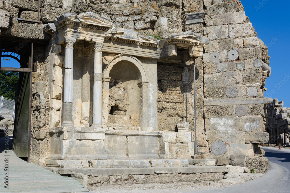the ruins of the monument of Vespasian and Titus in the ancient city. Side, Turkey