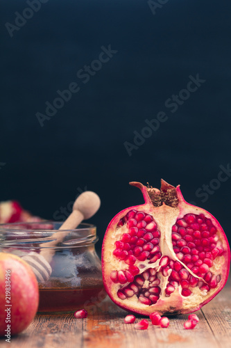 Rosh HaShanah Jewish New Year Composition with apples, pomegranate and honey