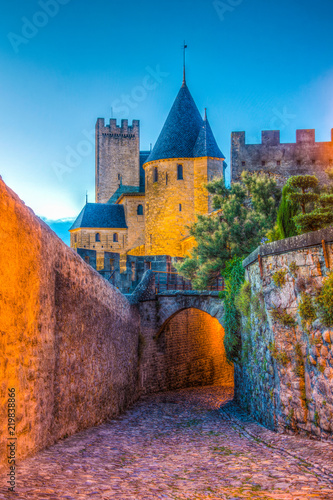 Fototapeta Night view over illuminated fortification of Carcassonne, France