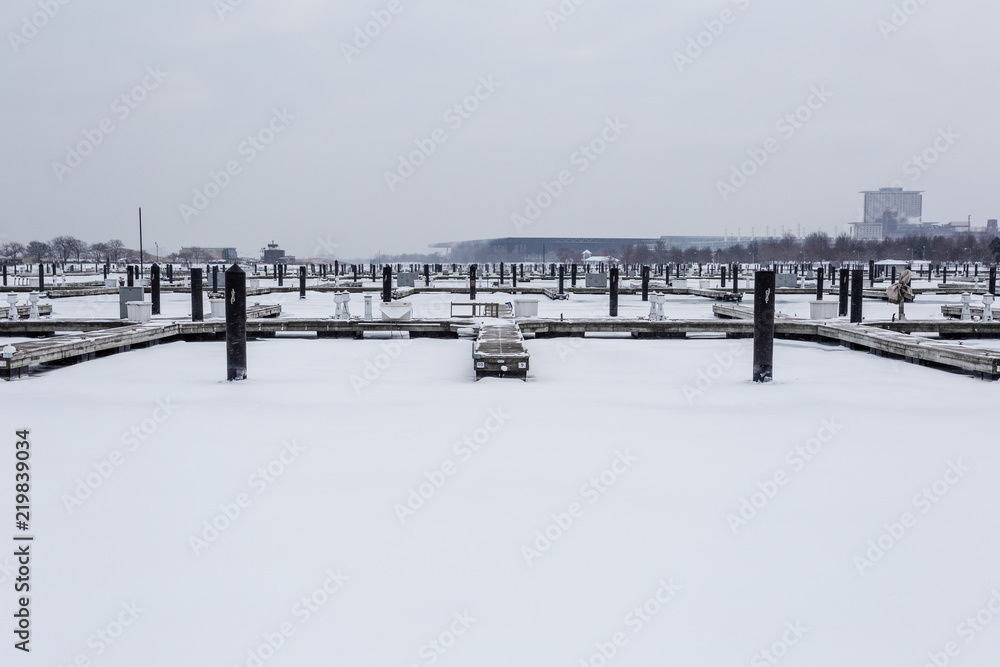 Naklejka premium Empty boat docks frozen in ice
