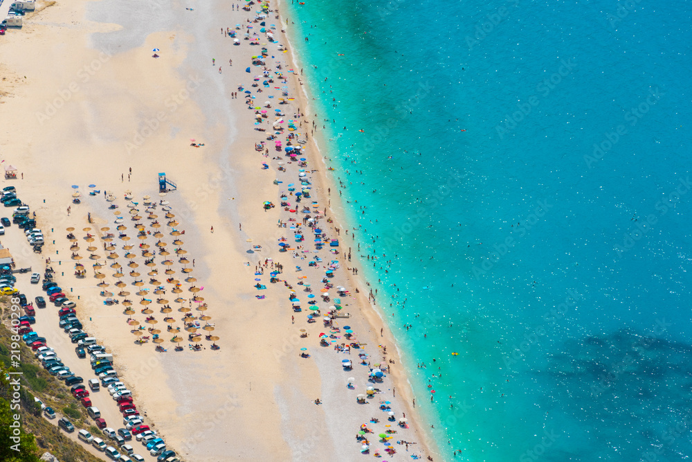 Aerial view of Myrtos beach in Kefalonia ionian island in Greece during summer in high tourist period. One of the most famous beaches in the world with turquoise crystal clear sea waters 