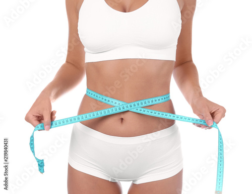 Slim woman with measuring tape on white background. Healthy diet