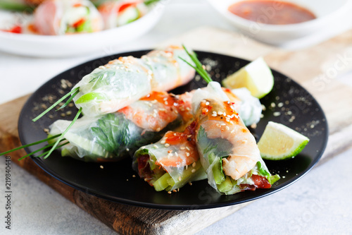 Fresh spicy vietnamese salad rolls with shrimp on a white plate