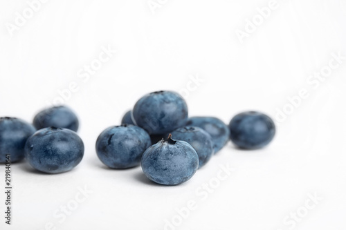 Tasty ripe blueberry on white background, closeup