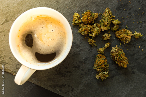 Sticker Delicious cup of coffee with a pile of high quality marijuana buds