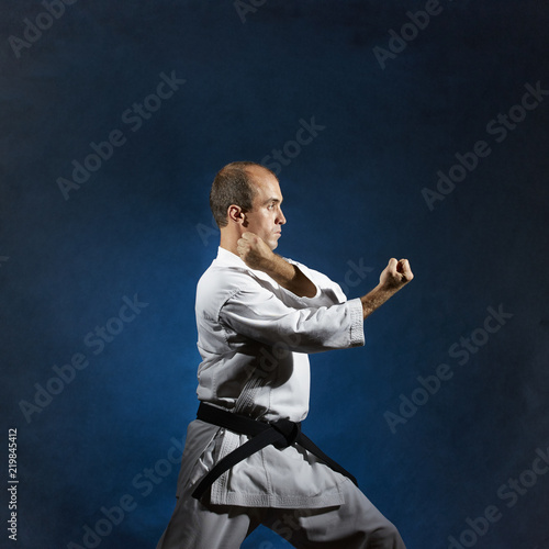 A male athlete performs formal karate exercises