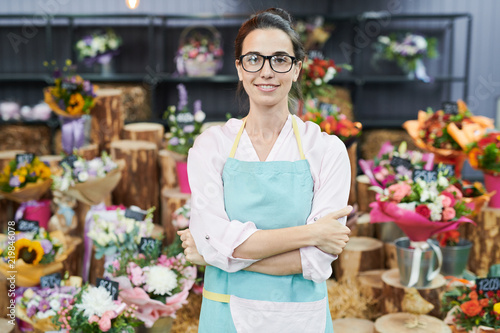 Portrait of female floser shop owner posing confidently and looking at camera photo