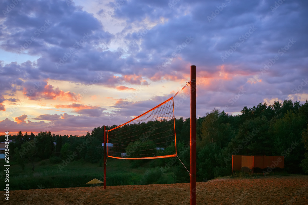 Playground With Beach Volleyball Net Under The Sunset Sky Playground With Beach Volleyball Net Under The Sunset Sky
