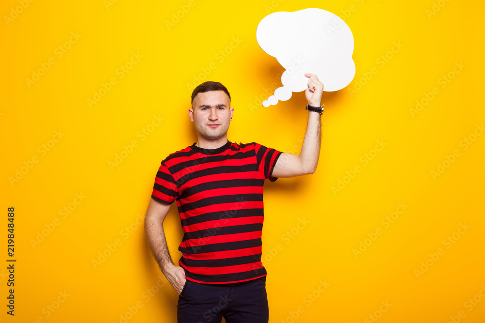 Handsome man in bright T-shirt with speech bubble Handsome man in bright T-shirt with speech bubble