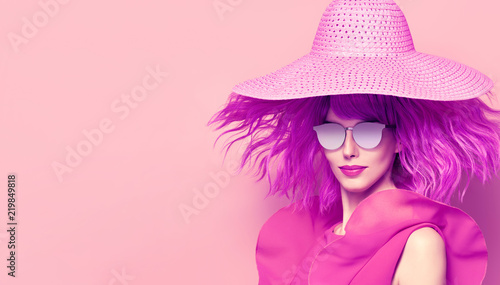 Young Beautiful Woman in Pink Summer Dress, Party Purple Hairstyle. Fashion Studio Portrait Glamour Lady. Playful Model Girl in Stylish Hat, Trendy Sunglasses. Creative Art © evgenij918