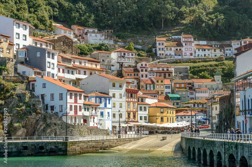 The port of Cudillero village in northern Spain with its colorful white yellow and red houses, taken from the sea