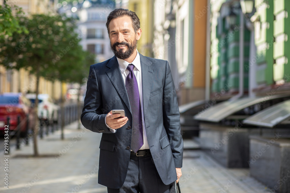 Joyful businessman going to work in the morning Joyful businessman going to work in the morning