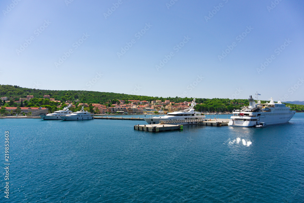 Cruise port of Argostoli in Kefalonia, ionian island in Greece. A few yachts and ships are docked into the quay. The quay is mainly used for large and cruise ships