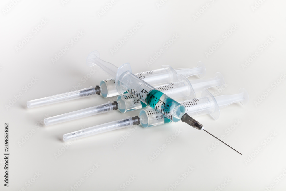 Several syringe on white table prepared for injection in hospital Several syringe on white table prepared for injection in hospital