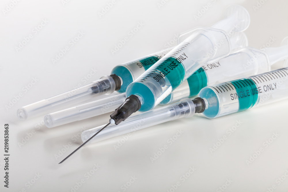 Several syringe on white table prepared for injection in hospital Several syringe on white table prepared for injection in hospital