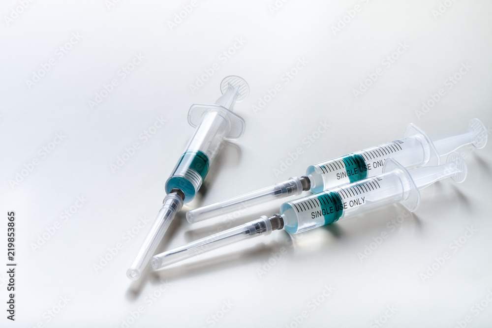 Several syringe on white table prepared for injection in hospital Several syringe on white table prepared for injection in hospital