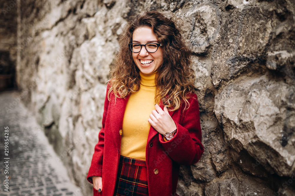 Cute girl with curly hair walking outdoor Cute girl with curly hair walking outdoor