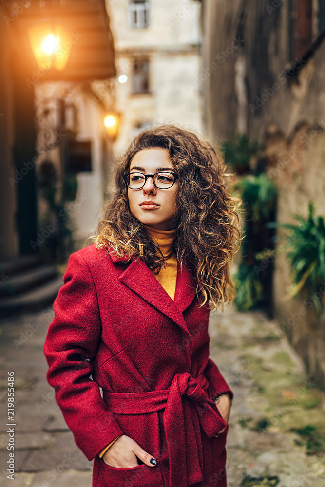 Cute girl with curly hair walking outdoor Cute girl with curly hair walking outdoor