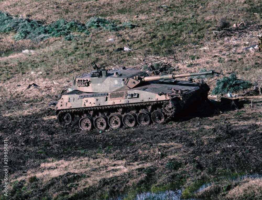 Tank Military Army Vehicle Gun armored machine cannon in a field daylight strategic transport forces Tank Military Army Vehicle Gun armored machine cannon in a field daylight strategic transport forces