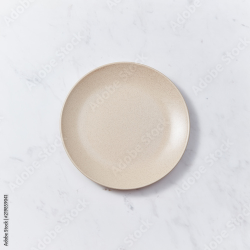 The handmade ceramic dish on a gray marble table. Traditional ceramic handcrafted. Flat lay