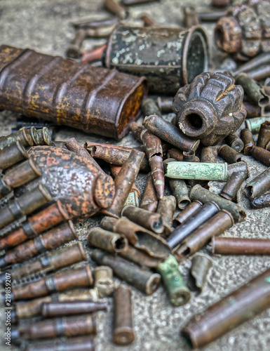 Military background with cartridges of grenades and machine-gun tape. Black archeology. World War II and its artifacts. Great Patriotic War of the USSR