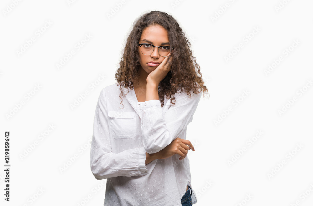 Beautiful young hispanic woman thinking looking tired and bored with depression problems with crossed arms. Beautiful young hispanic woman thinking looking tired and bored with depression problems with crossed arms.