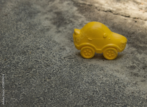 Yellow toy car.