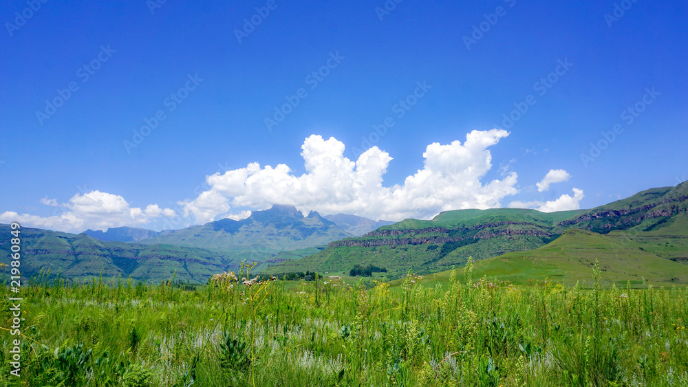 Rich nature with grass and mountains, clouds, in Drakensberg Giant Castle, South Africa 