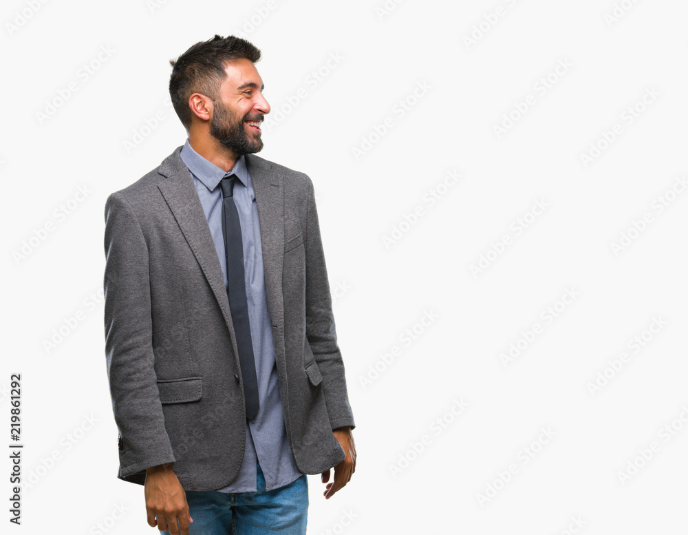 Adult hispanic business man over isolated background looking away to side with smile on face, natural expression. Laughing confident. Adult hispanic business man over isolated background looking away to side with smile on face, natural expression. Laughing confident.