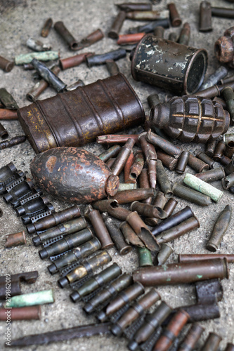 Military background with cartridges of grenades and machine-gun tape. Black archeology. World War II and its artifacts. Great Patriotic War of the USSR