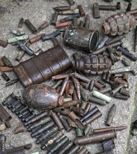 Military background with cartridges of grenades and machine-gun tape. Black archeology. World War II and its artifacts. Great Patriotic War of the USSR