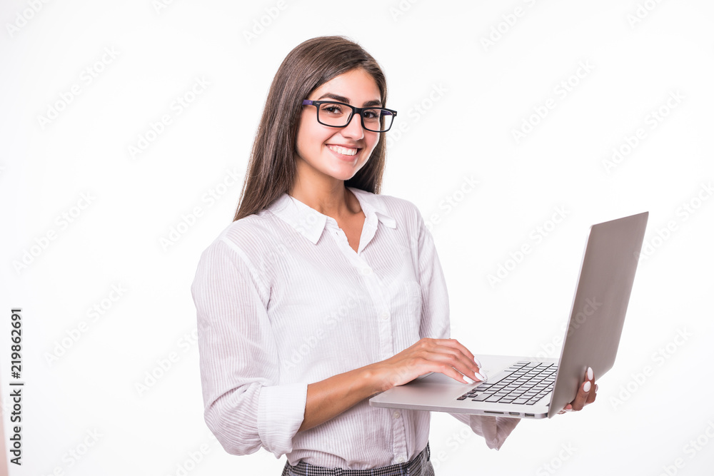 Successful business woman is standing with laptop in hands on isolated background. Successful business woman is standing with laptop in hands on isolated background.