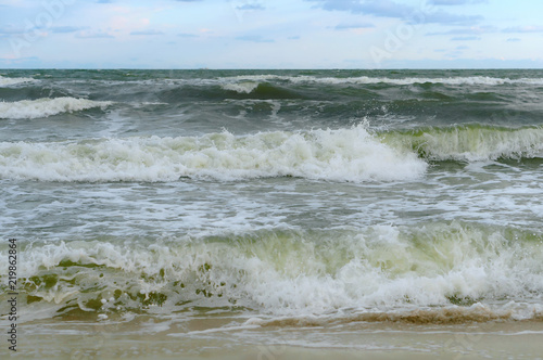 Sea coast. Waves and storms at sea. Waves on the Baltic Sea.